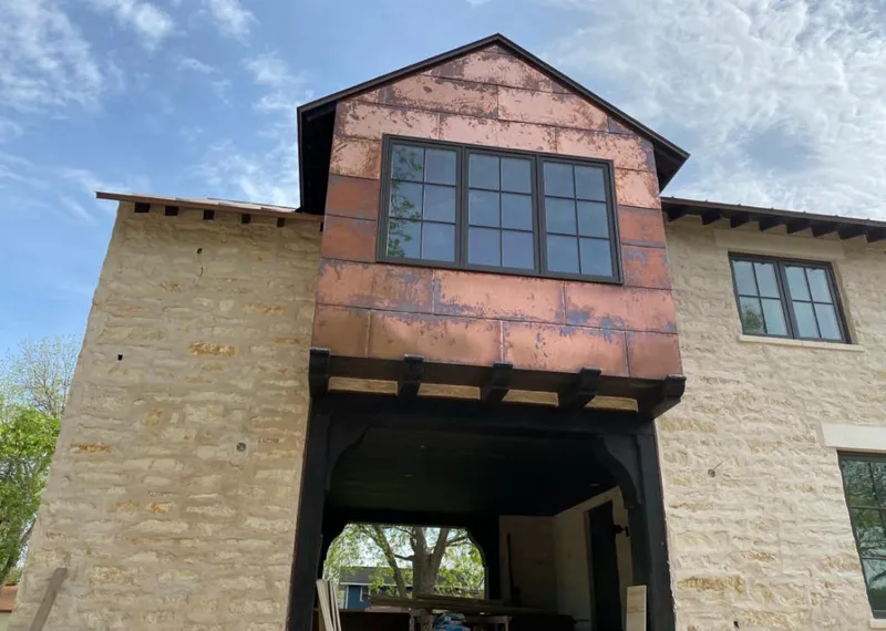 Copper metal panel facade on a stone building for Skylight Installation in Glendale
